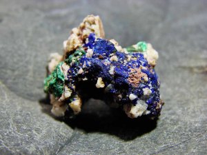 Natural azurite and malachite mineral on matrix with bright blue and green copper mineralization.